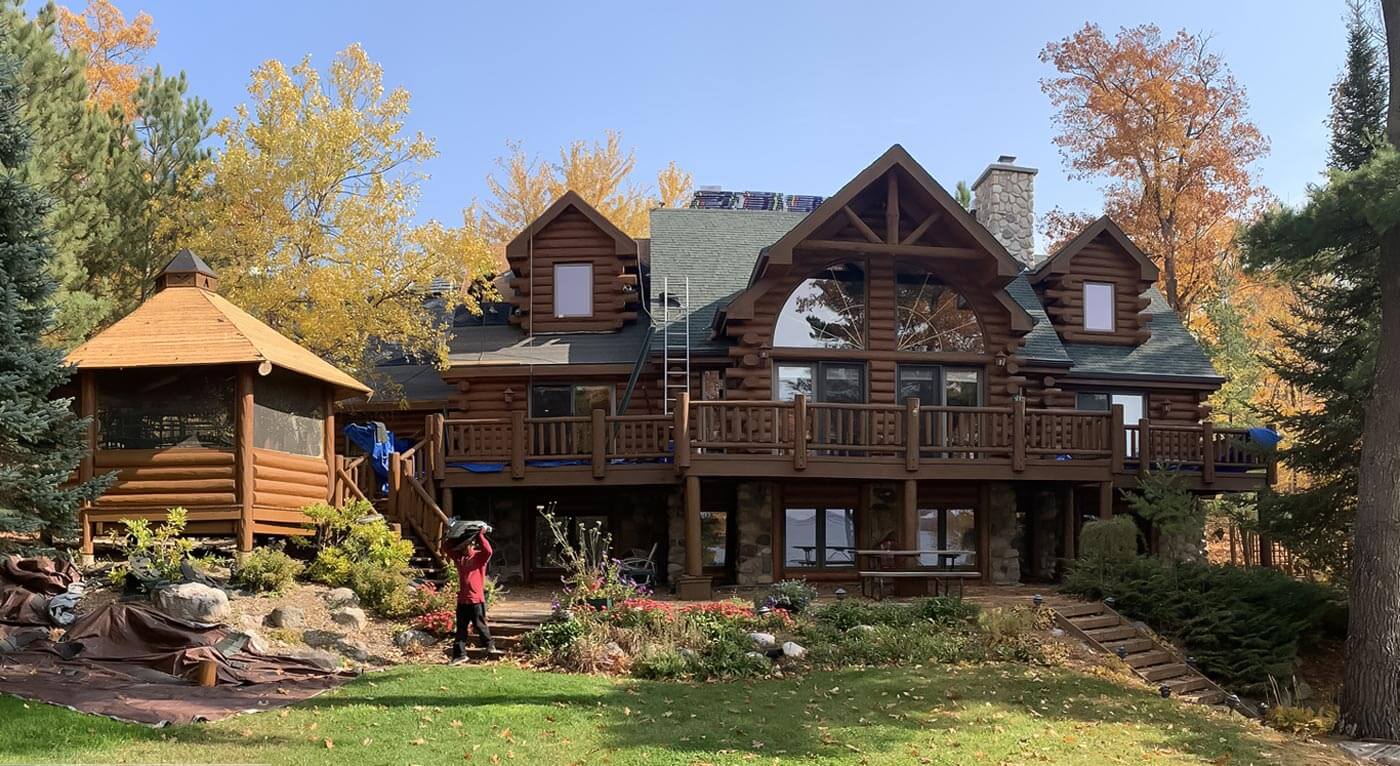 Roofing installation on a beautiful two-story home